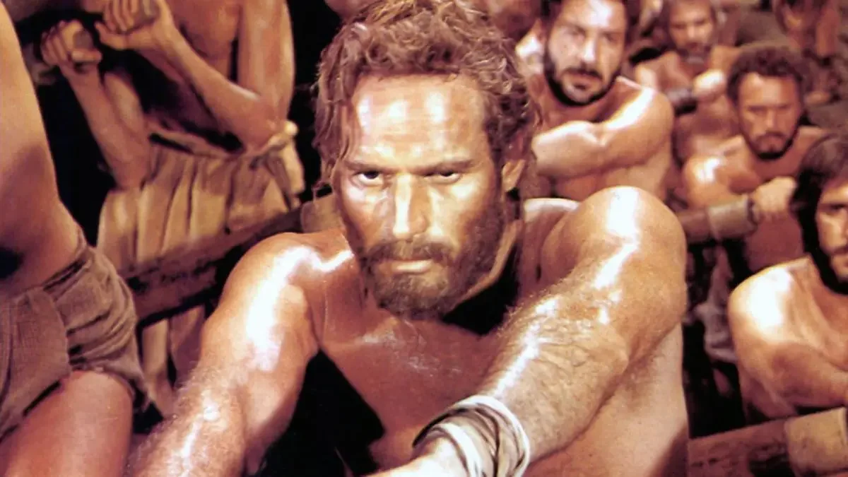 Charlton Heston rowing as a galley slave in the film Ben Hur.