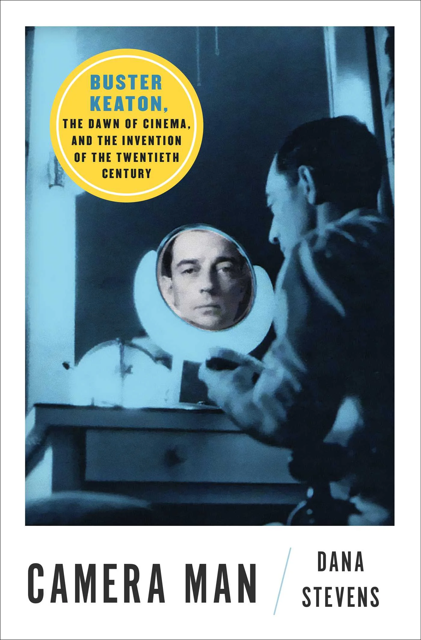 ![Book cover for "Camera Man" by Dana Stevens. Features a vintage image of a man gazing into a mirror, with a reflection of a serene face. Yellow circle states: "Buster Keaton, the dawn of cinema, and the invention of the twentieth century." Tones are blue and monochromatic, evoking nostalgia.](/media/images/camera-man.webp)