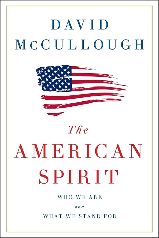 Book cover of "The American Spirit" by David McCullough, featuring a stylized American flag brushstroke above the title in bold red and blue letters.