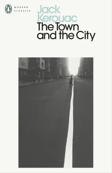 Penguin Modern Classics cover of "The Town and the City" by Jack Kerouac, showing a black-and-white photo of a lone figure crossing an empty city street.