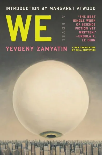 Cover of "We" by Yevgeny Zamyatin, featuring a minimalist design with bold typography and a stark color palette.  A large eyeball dominates the cover as it stares directly down on a cityscape.